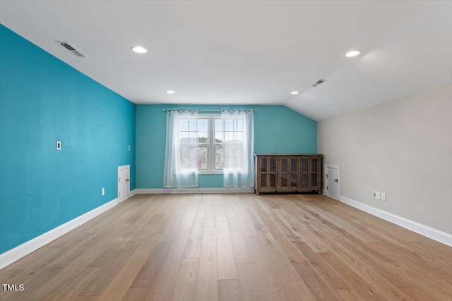 interior space featuring wood finished floors, visible vents, and baseboards