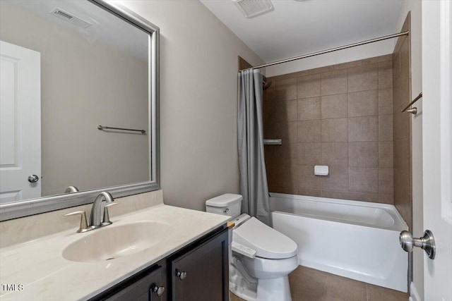 full bath with visible vents, shower / tub combo with curtain, vanity, and toilet