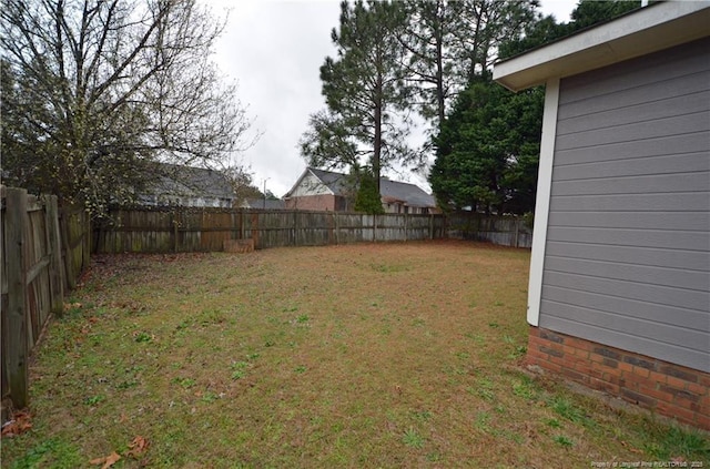 view of yard featuring a fenced backyard