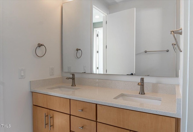 bathroom with double vanity and a sink