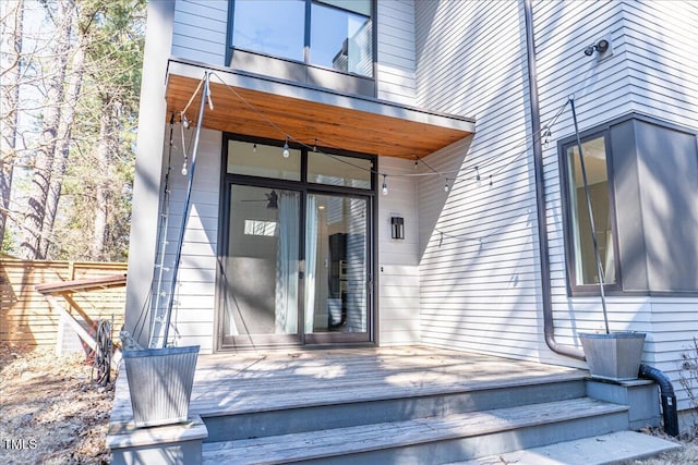 entrance to property featuring a deck