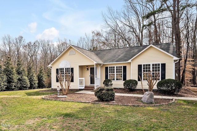 single story home featuring a front lawn and a shingled roof