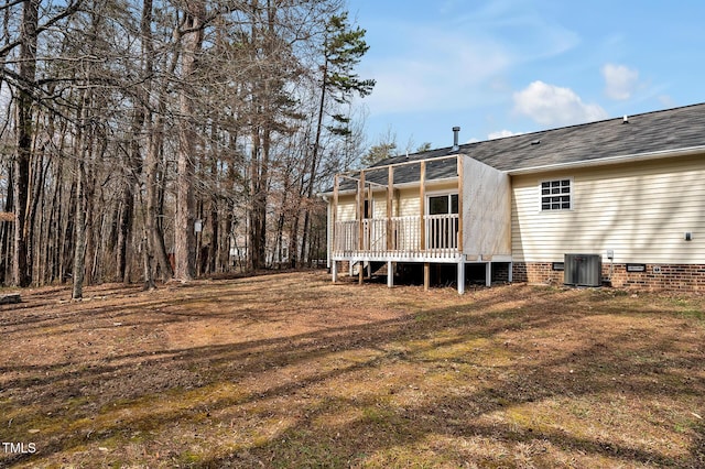 back of property with crawl space, a deck, and central AC unit