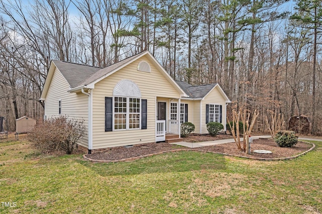 ranch-style home with crawl space, a front lawn, and roof with shingles