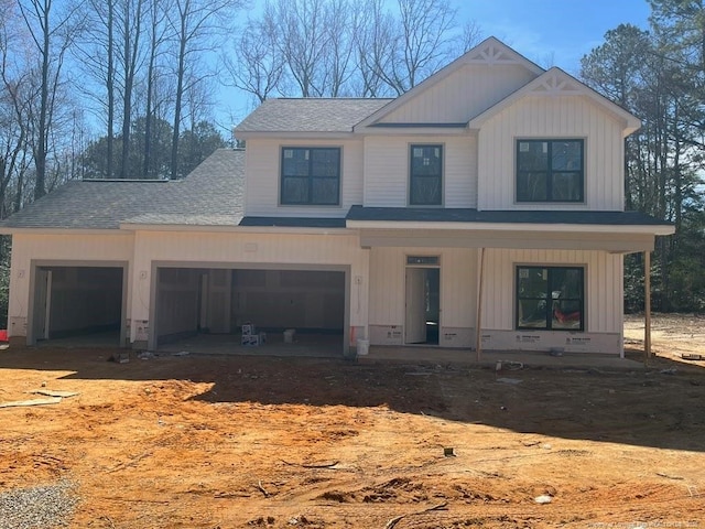 view of front of home with board and batten siding, a porch, roof with shingles, and dirt driveway