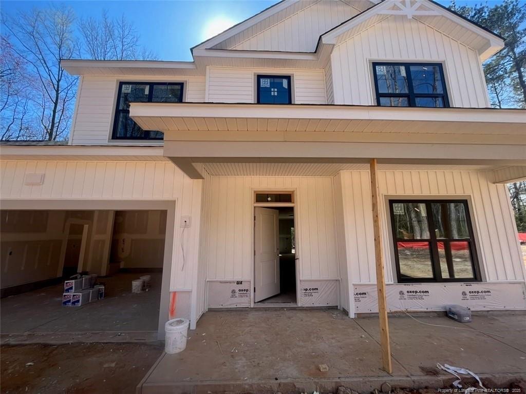 view of front facade with a porch and an attached garage