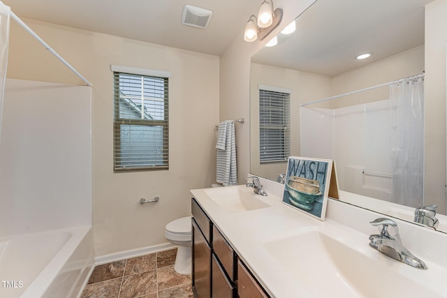 full bathroom featuring toilet, a sink, visible vents, and baseboards