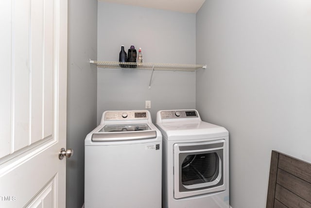 laundry area featuring laundry area and washing machine and dryer