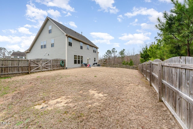 back of property with a fenced backyard