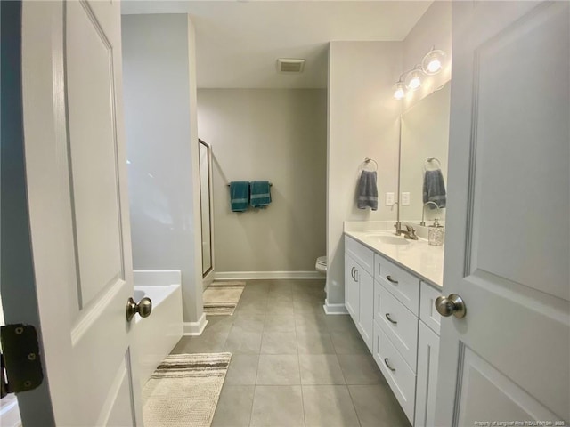 bathroom featuring a stall shower, visible vents, toilet, tile patterned flooring, and vanity