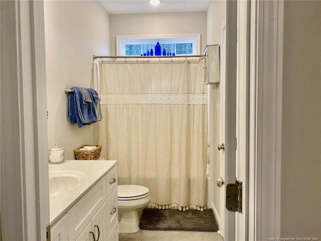 bathroom featuring toilet, tile patterned flooring, shower / bath combo, and vanity