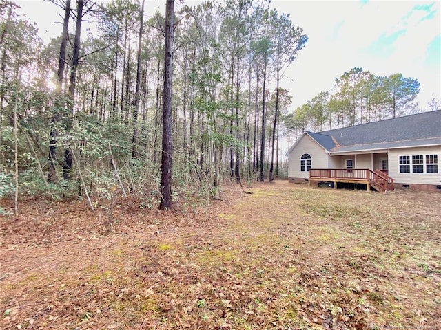 view of yard with a deck