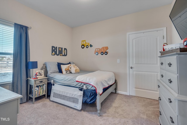 bedroom with light colored carpet