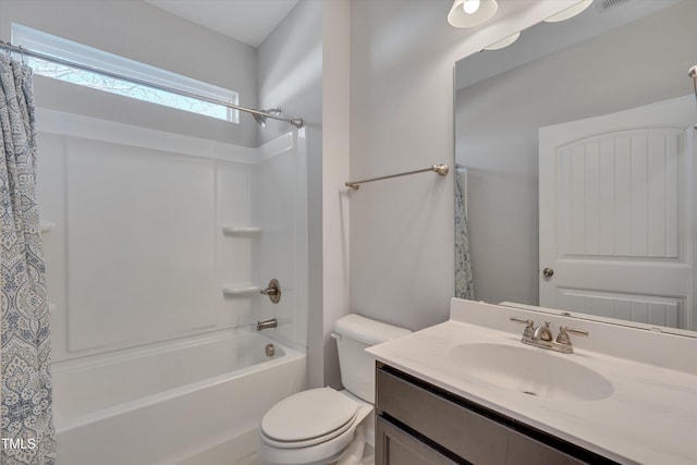 bathroom with shower / tub combo, vanity, and toilet