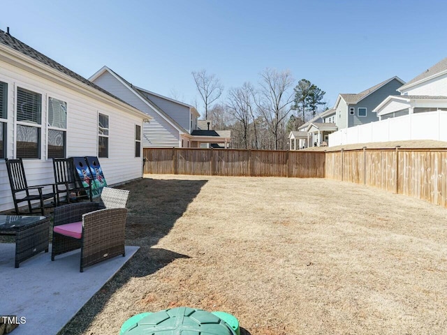 view of yard with a residential view and fence