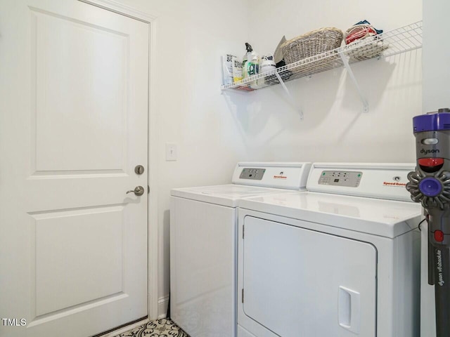 washroom with laundry area and washer and dryer