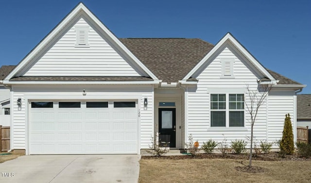 single story home with a garage, driveway, a shingled roof, and fence