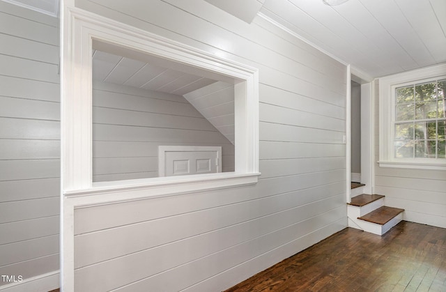 room details with wood finished floors and wooden walls