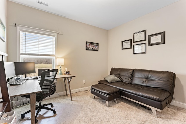 carpeted home office with visible vents and baseboards