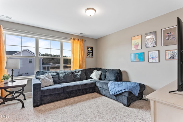 carpeted living room with visible vents