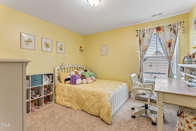 bedroom with visible vents and carpet flooring