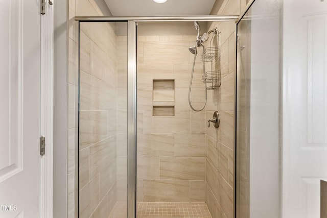 full bathroom featuring a shower stall