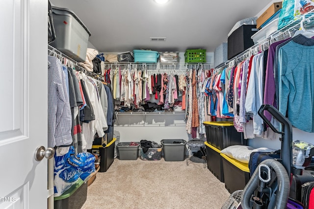 spacious closet with carpet flooring and visible vents