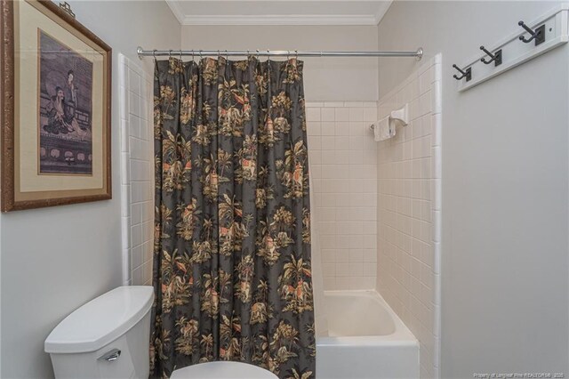 bathroom with toilet, shower / bath combo, and crown molding