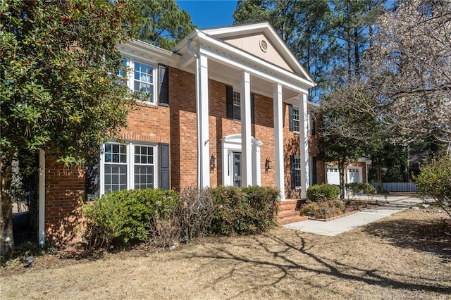 greek revival house with brick siding