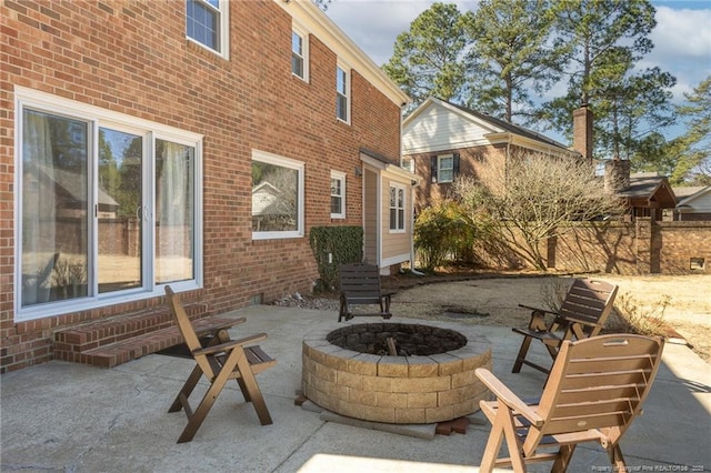 view of patio / terrace with a fire pit and entry steps