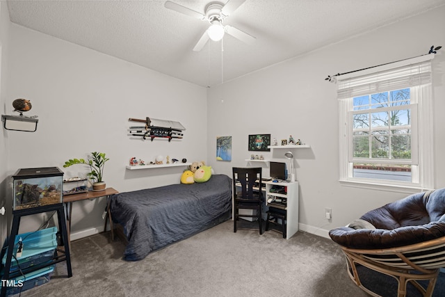 bedroom featuring carpet floors, a textured ceiling, baseboards, and a ceiling fan