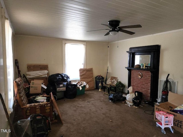 interior space featuring carpet, a ceiling fan, and crown molding