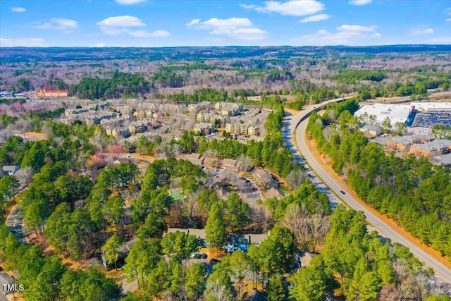 bird's eye view featuring a forest view