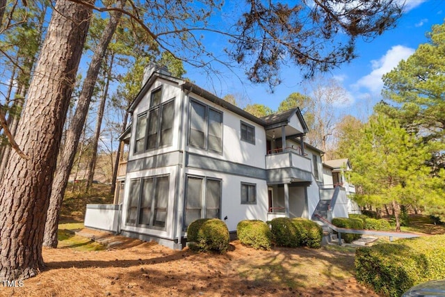 rear view of house with a balcony