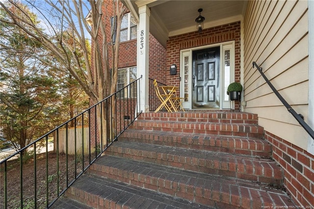 entrance to property with brick siding