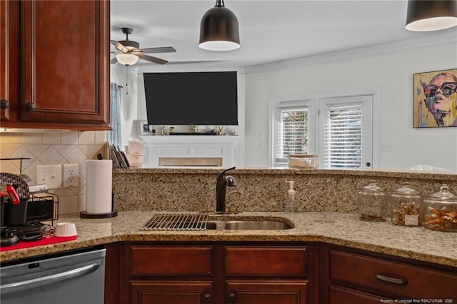 kitchen featuring light stone counters, a sink, backsplash, dishwasher, and crown molding