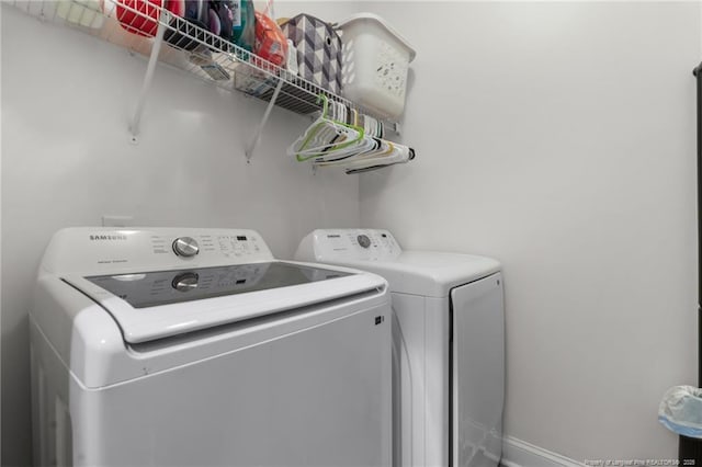 washroom featuring laundry area and washer and clothes dryer