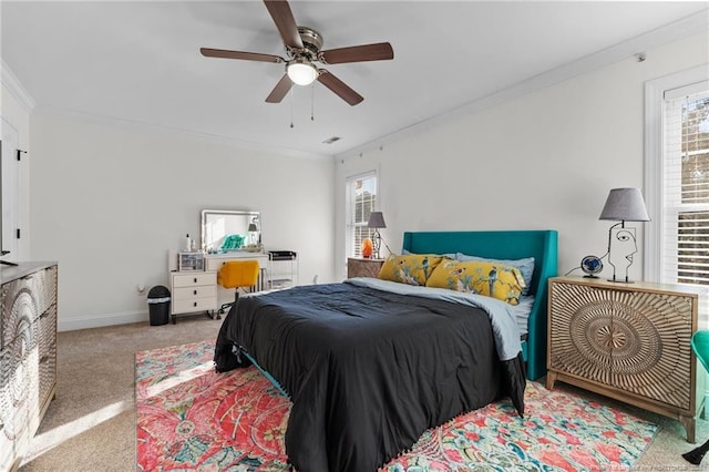 bedroom featuring baseboards, multiple windows, carpet flooring, and crown molding