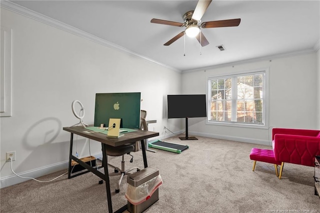 carpeted office space with a ceiling fan, visible vents, crown molding, and baseboards