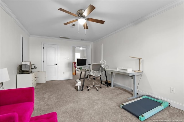 carpeted office featuring a ceiling fan, baseboards, visible vents, and crown molding