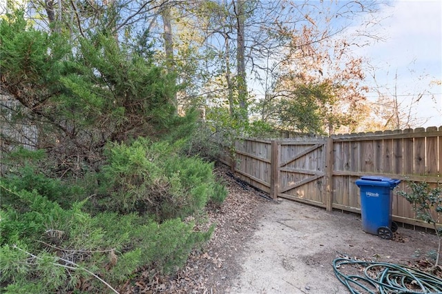 view of gate featuring fence