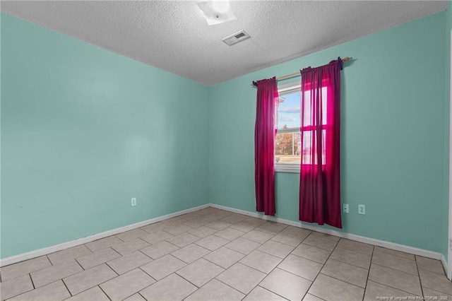 616 Missenburg Ct, Fayetteville, NC 28314 - tiled spare room featuring a textured ceiling, visible vents, and baseboards