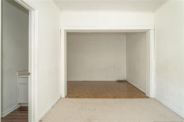 hallway featuring ornamental molding