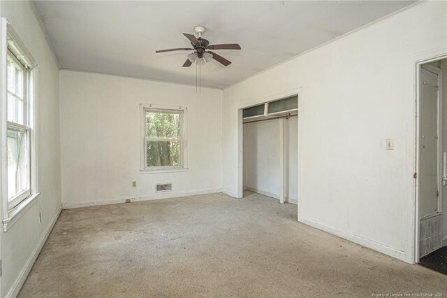 unfurnished bedroom featuring a closet, visible vents, and ceiling fan