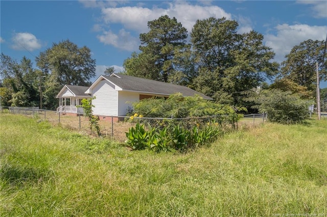 view of side of home with fence