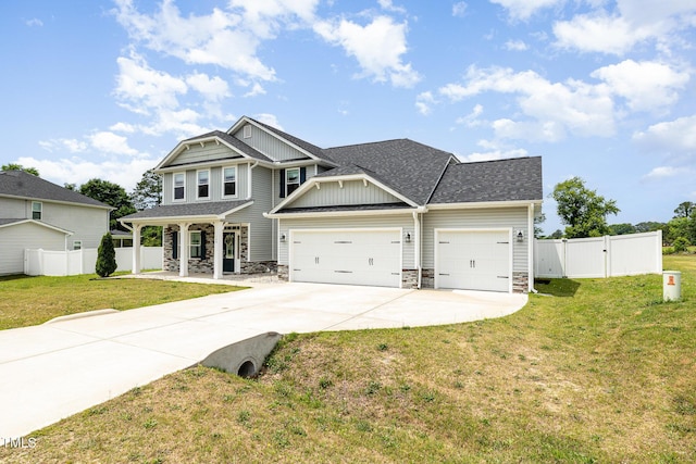 craftsman-style house with stone siding, an attached garage, concrete driveway, and a porch