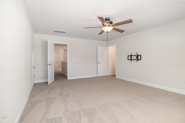 unfurnished bedroom featuring carpet flooring, baseboards, and ceiling fan