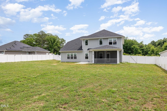 back of house with a sunroom and a patio