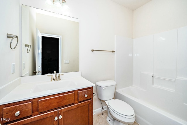 full bathroom featuring baseboards, vanity, and toilet