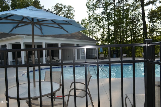 community pool featuring a patio